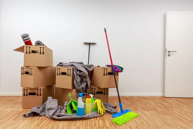 Empty room with mop and supplies for move-out cleaning in Apex, NC