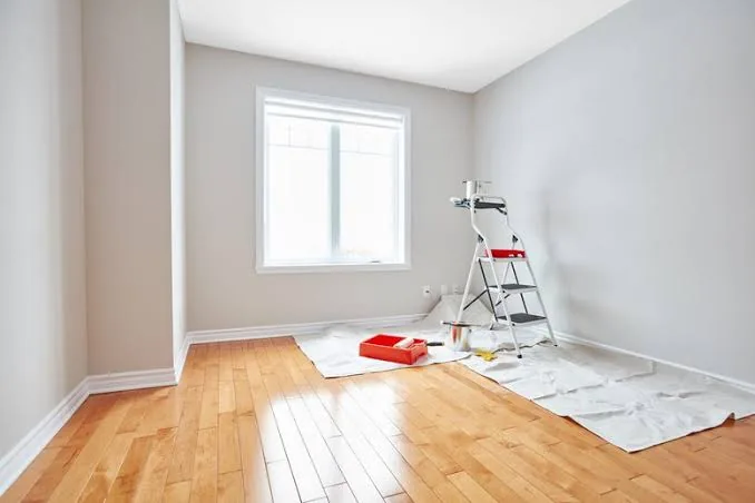 Freshly painted bedroom with floors protected in Raleigh, NC