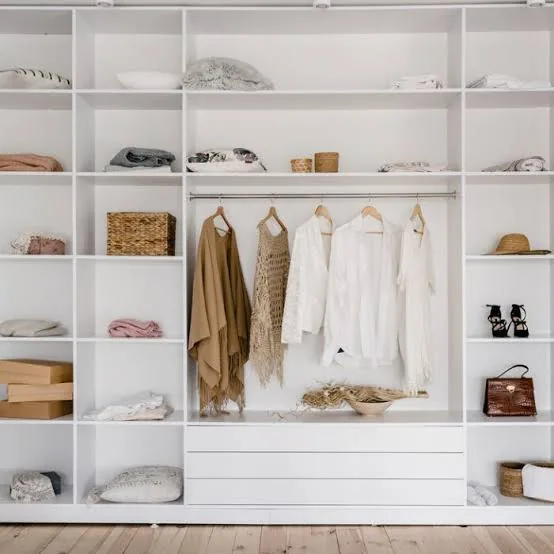 Minimalist open closet shelving organized in Cary, NC