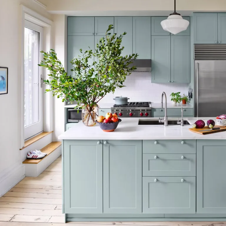 Sage green painted kitchen cabinets and island in Apex, NC